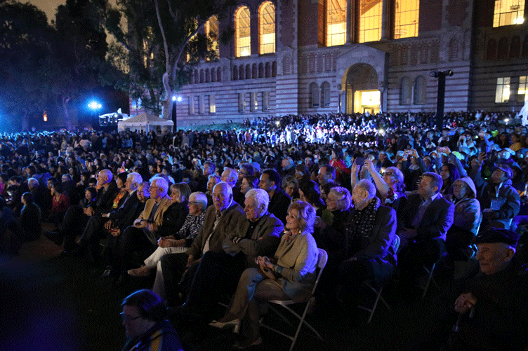 Crowds fill Dickson Plaza for the centennial projection show.