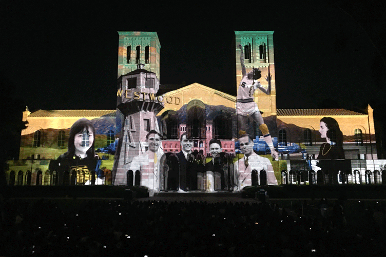 Royce Hall is lit with historical images of Westwood and notable leaders as part of a centennial projection show.